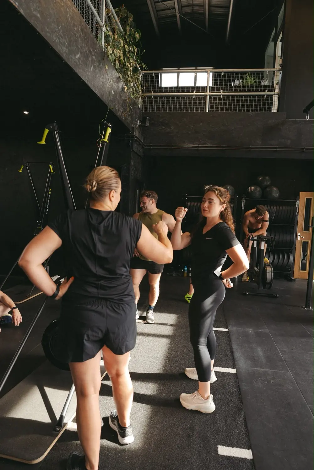 Coach talking a member through the session