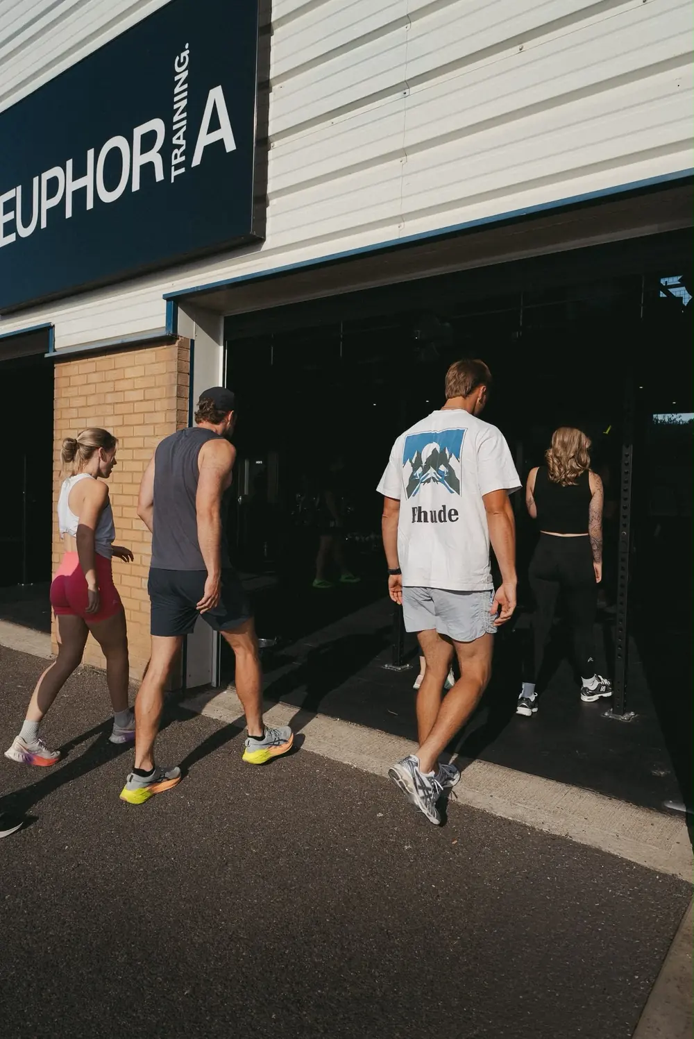 Members heading into the unit under the Euphoria sign