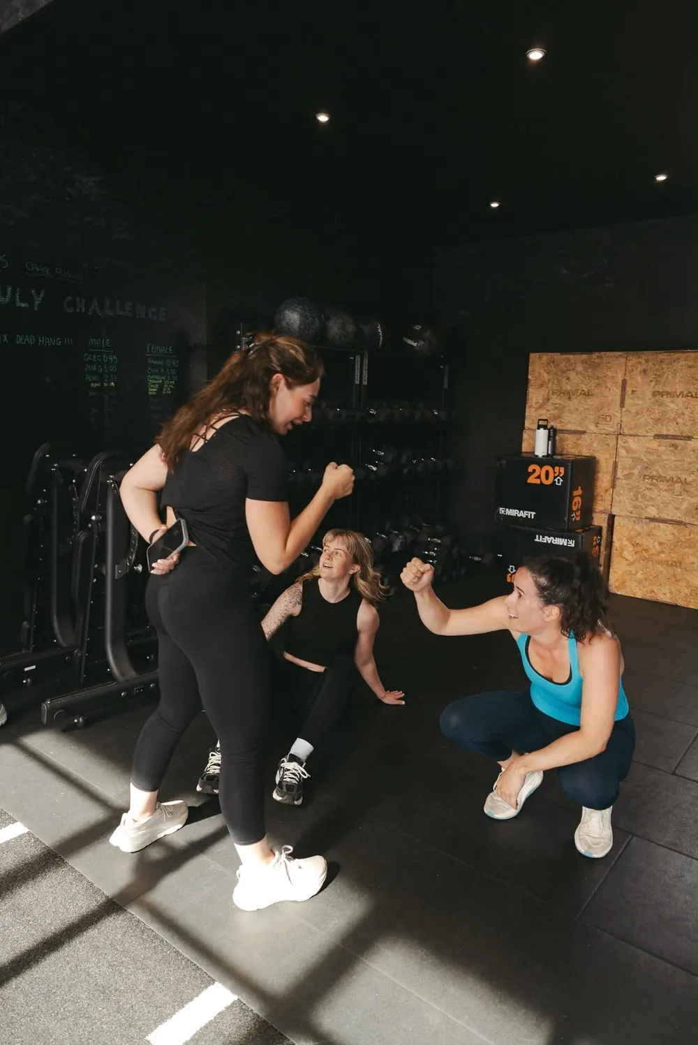 Members cheering each other on at the end of a team workout